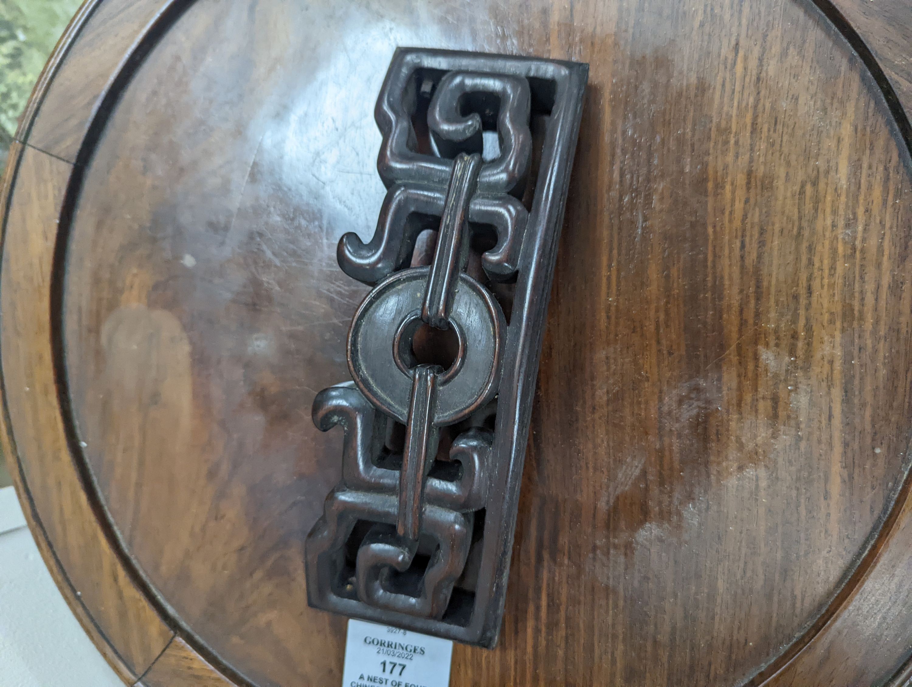 A nest of four Chinese hardwood circular tables, largest diameter 40cm, height 67cm